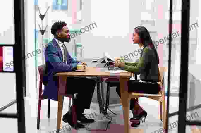 A Job Interviewer And A Job Candidate Sitting At A Table How To Master The Job Interview: Tricks And Tips For The Job Interviews: Myriad Of Successful Strategies