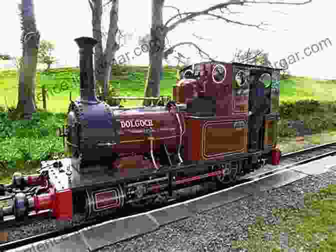 A Steam Powered Narrow Gauge Locomotive Hauling A Train Of Goods Through A Dense Forest Narrow Gauge In The Tropics: The Railways Of The Dutch East Indies 1864 1942 (Railroads Past And Present)