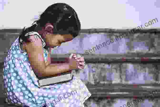 A Young Child Sits On Their Parent's Lap, Their Hands Folded In Prayer. Pass Your Faith To Your Children: Through The Simple Practice Of Teaching Your Child To Pray