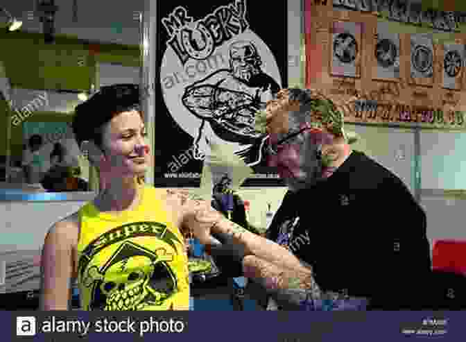 Tattoo Artist Inking A Client During A Convention Tattoo Events Jane King